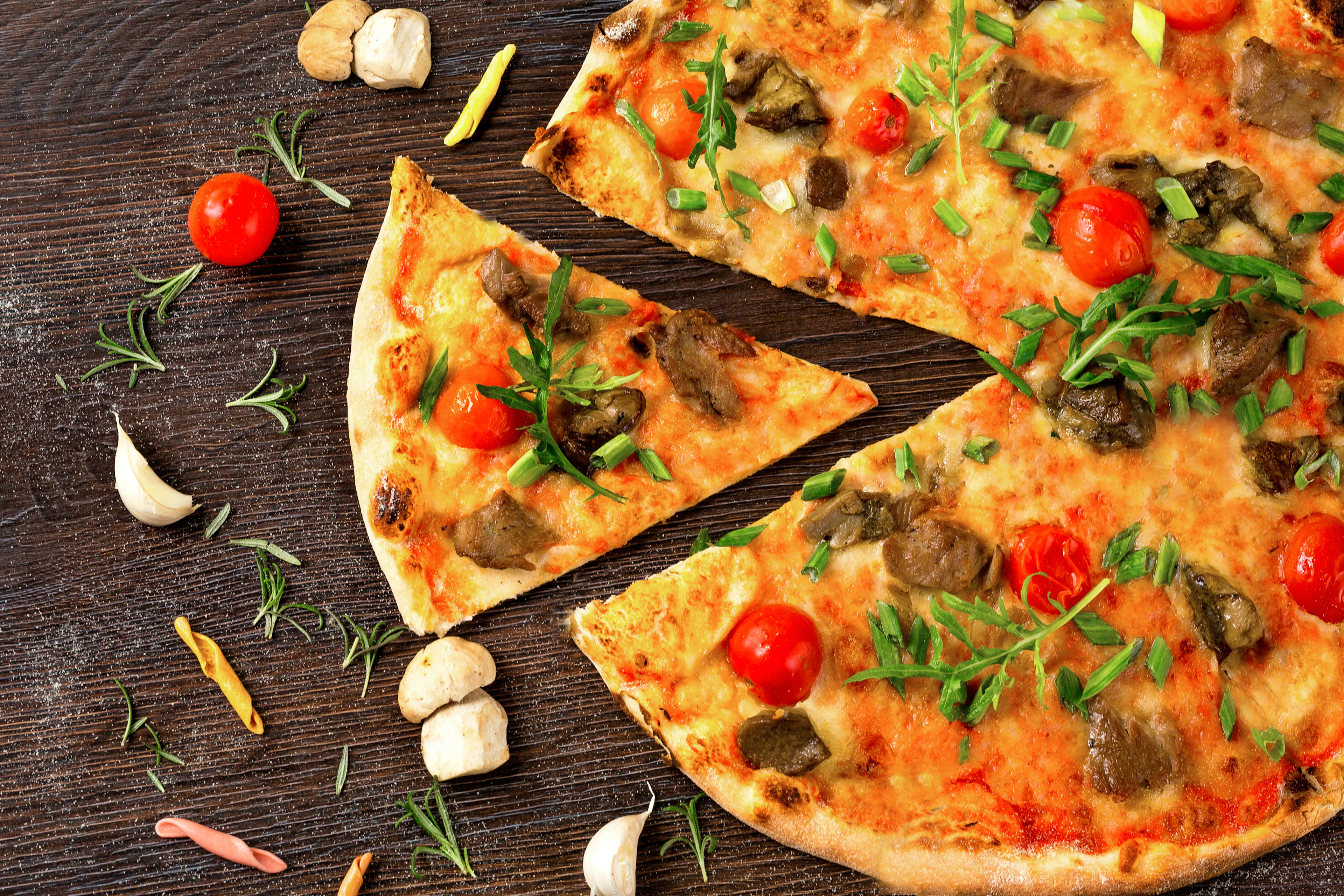 A flatbread loaded with toppings, fresh from the oven