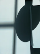 an abstract shadow play casting geometric patterns on dark walls