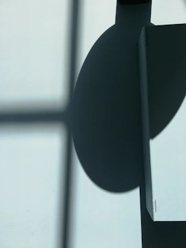 an abstract shadow play casting geometric patterns on dark walls