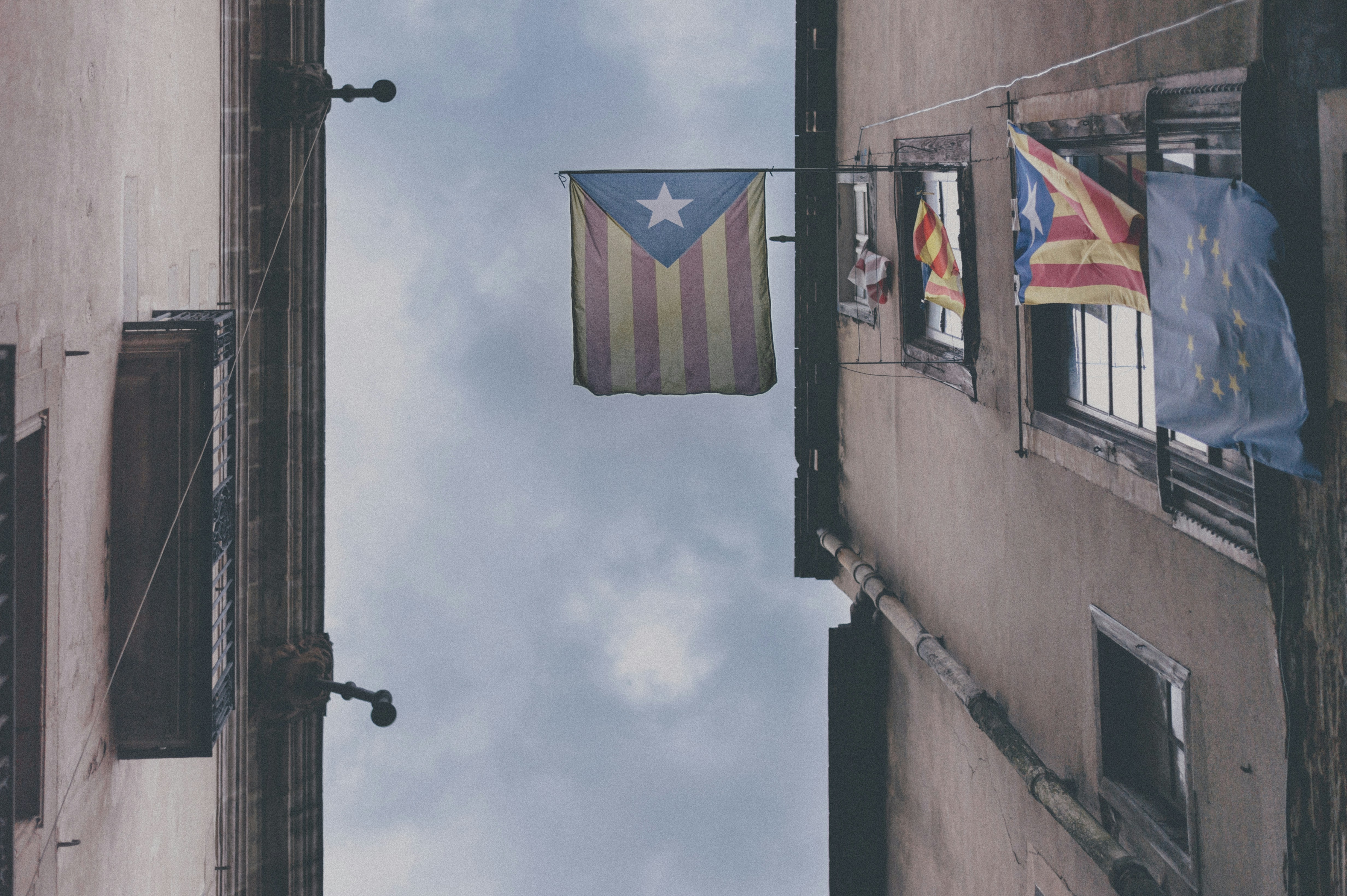 Flags of Catalonia and the European Union on the street of Barcelona.
