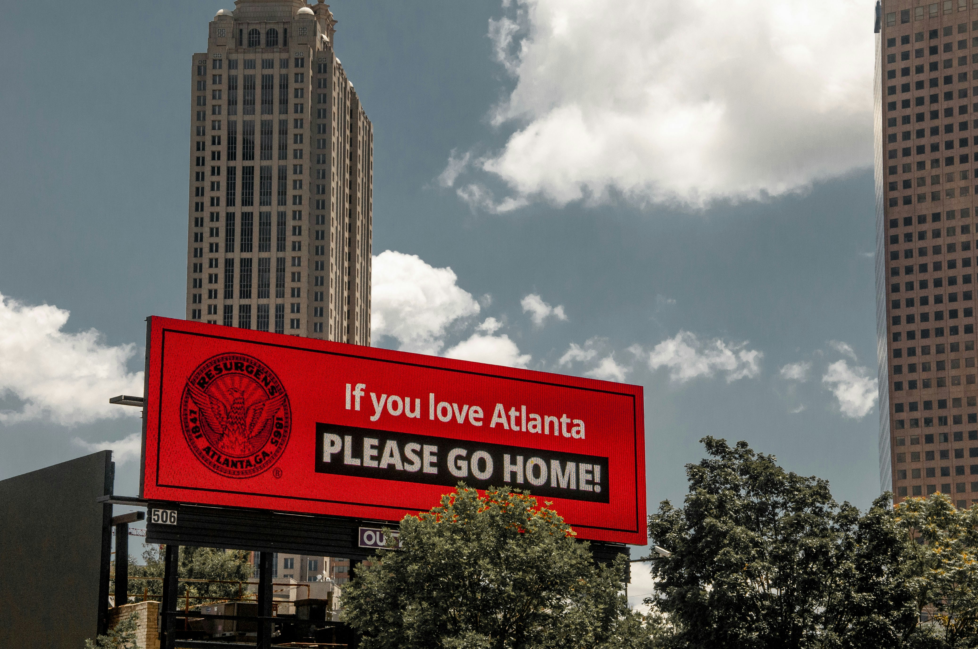 billboard urging protestors to go home