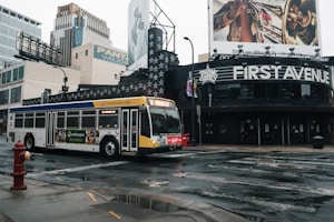 yellow and red bus on road during daytime