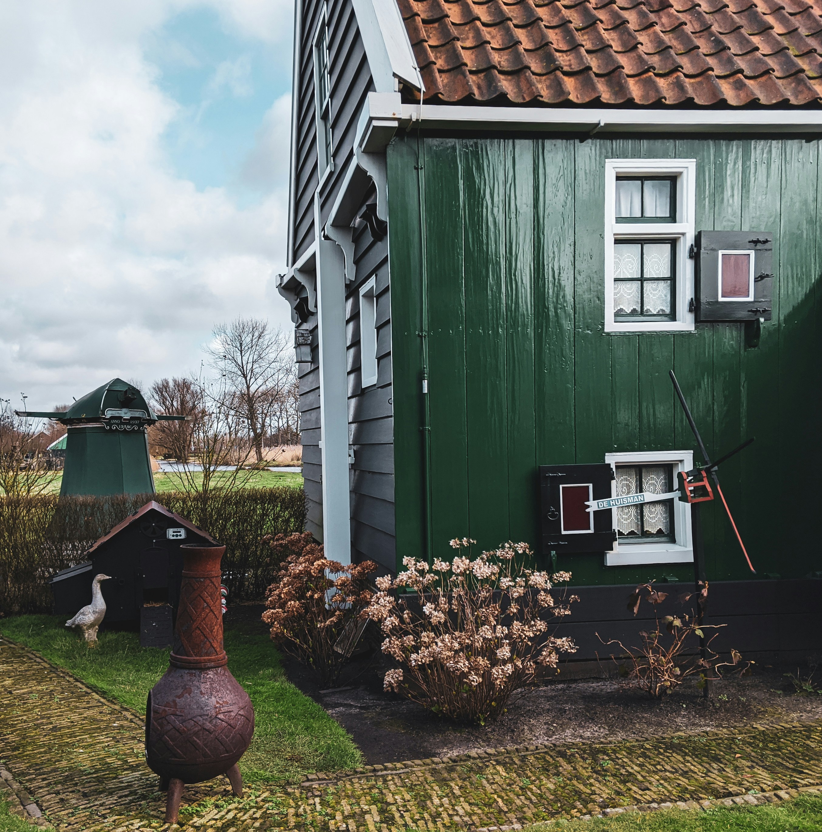 green and white wooden house