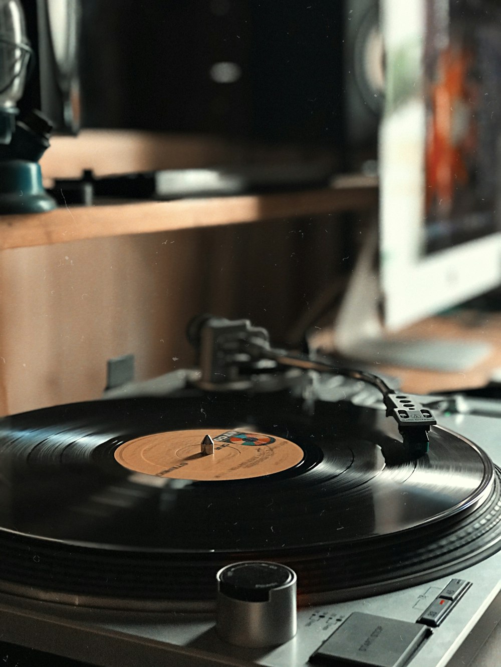 black vinyl record on vinyl record player