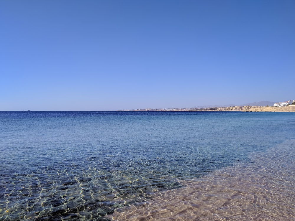 blue sea under blue sky during daytime