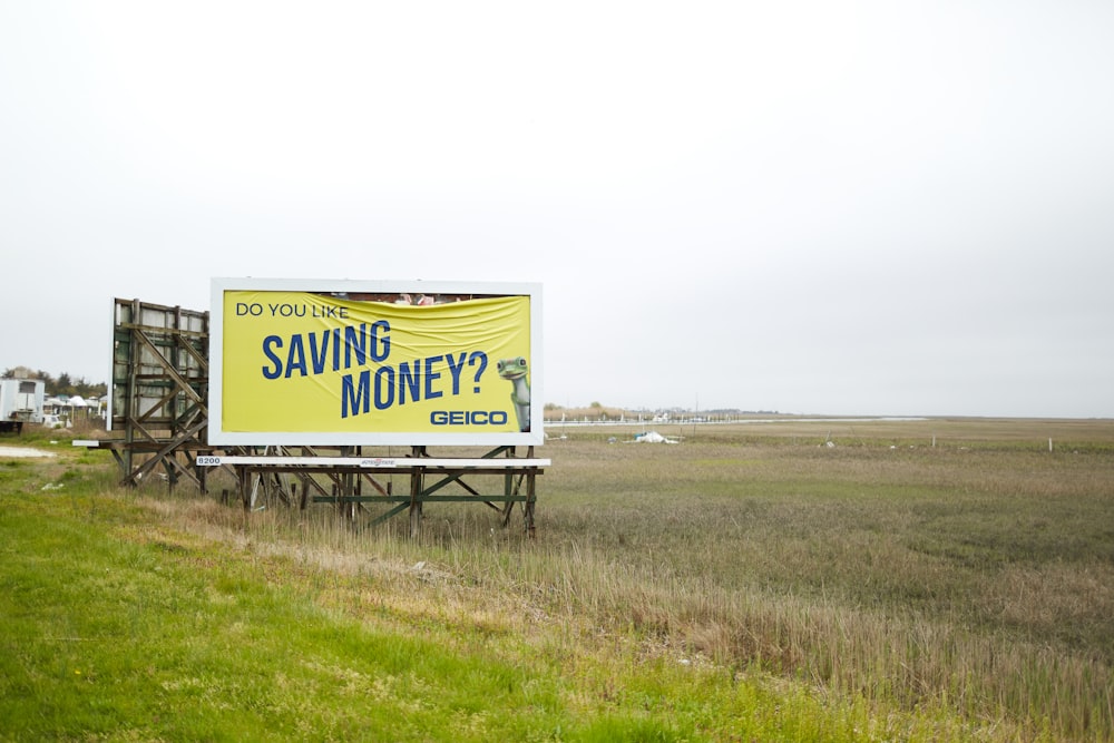 a billboard on the side of a road advertising saving money