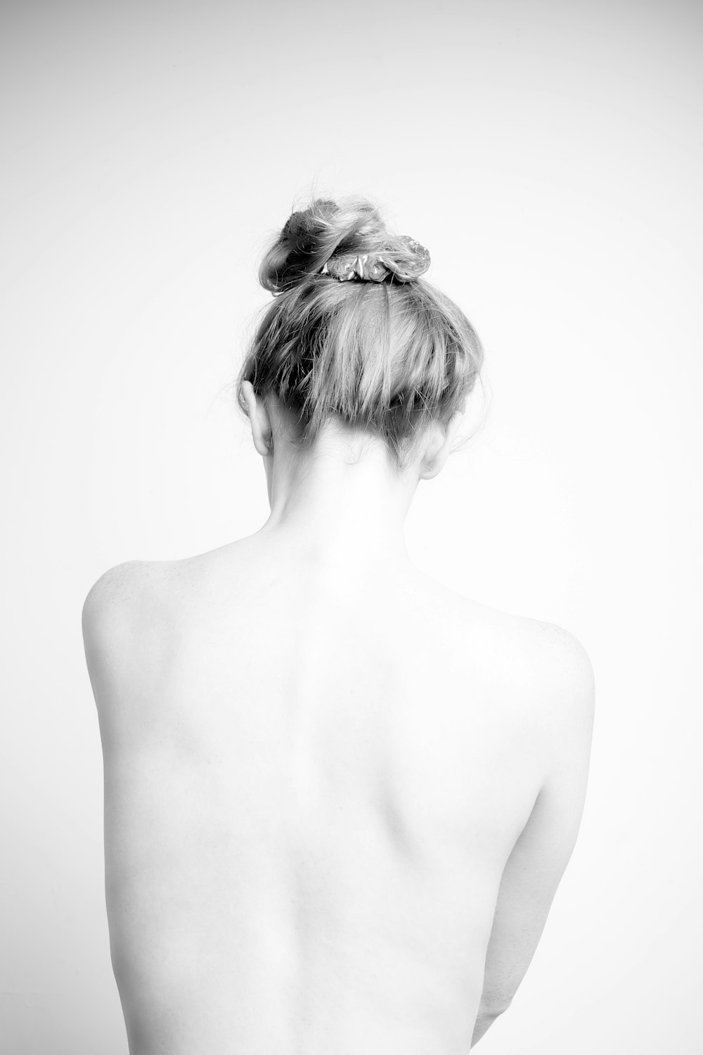 grayscale photo of topless woman