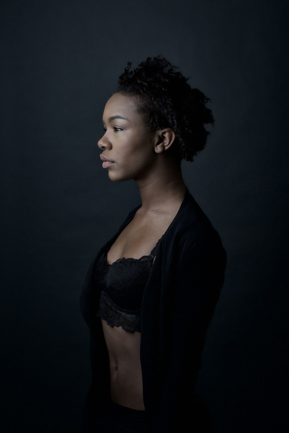 woman in black cardigan and white brassiere