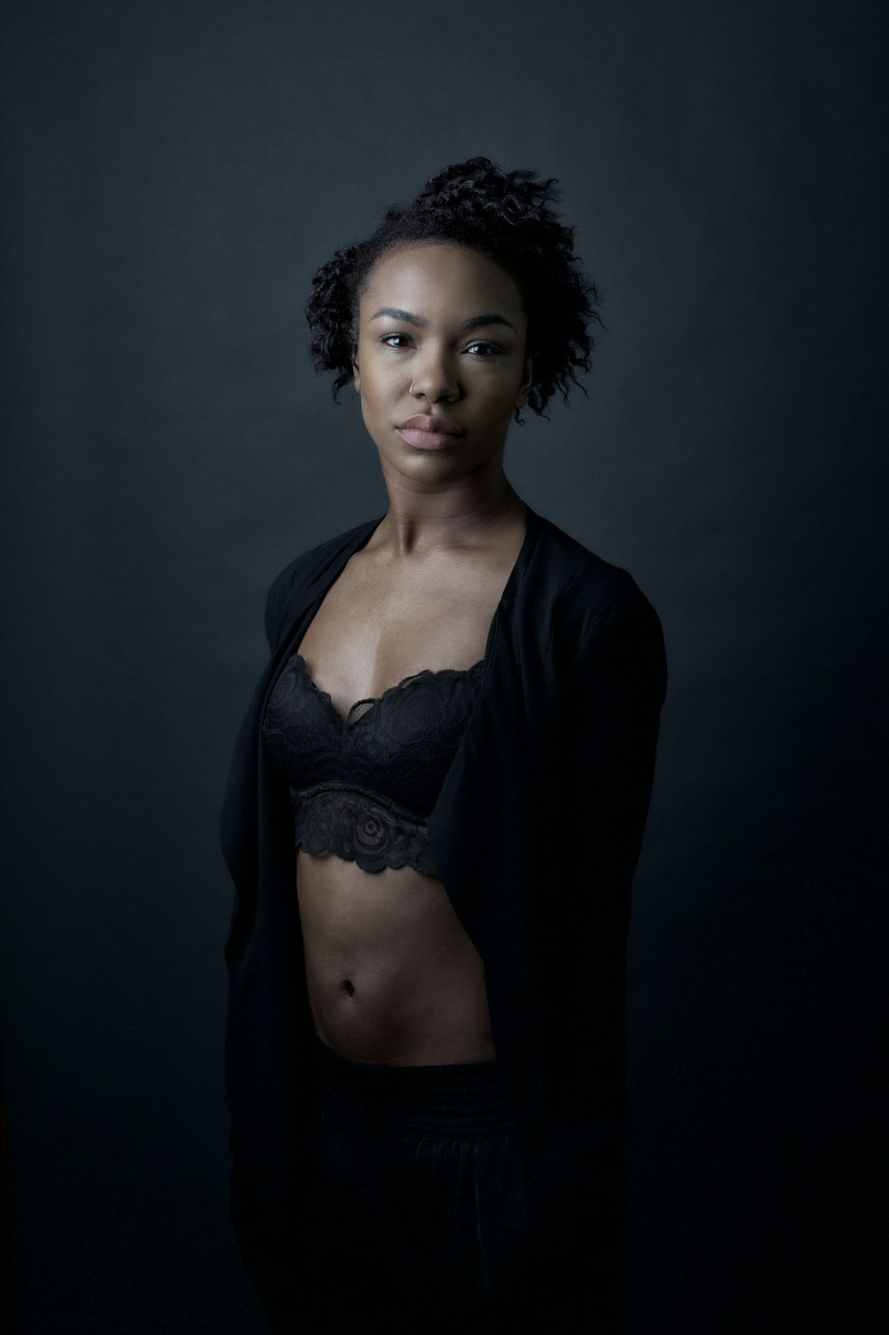 woman in black lace brassiere and black cardigan