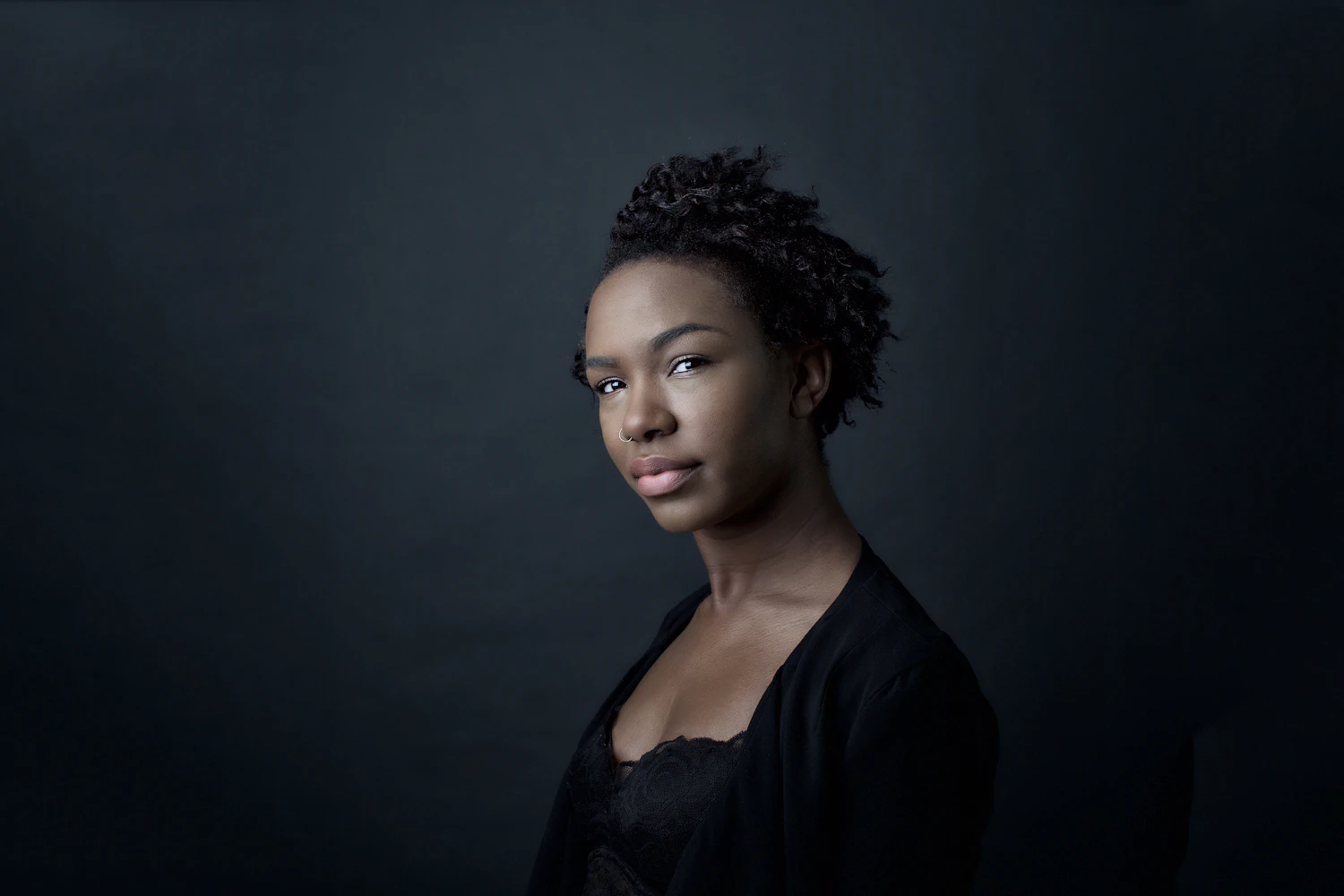 A member of the fan club photographed against a dark background