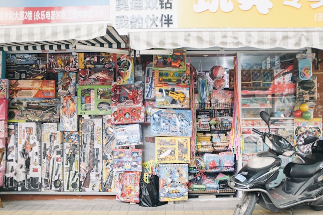 A cheerful display of Toy Hut’s most popular toys arranged invitingly on colorful shelves.