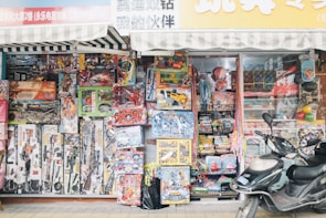 A display of various traditional and modern toys available at the খেলাপাতি store.