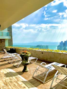 Luxurious penthouse terrace with sunset views and outdoor lounge in La Romana