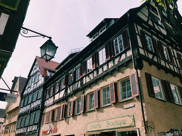 Charming half-timbered houses lining a sunny street in Troyes' historic center.