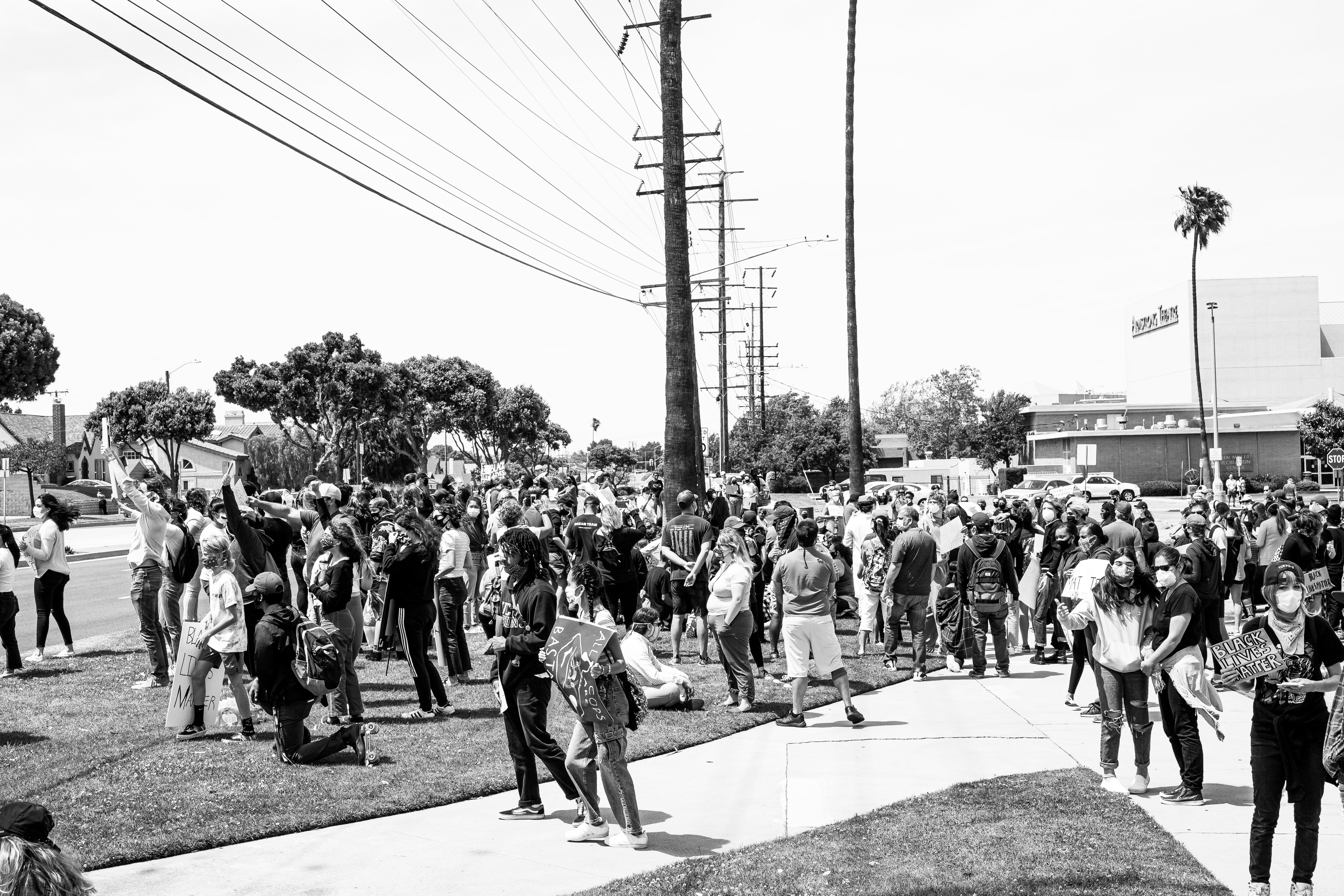 grayscale photo of people walking on street