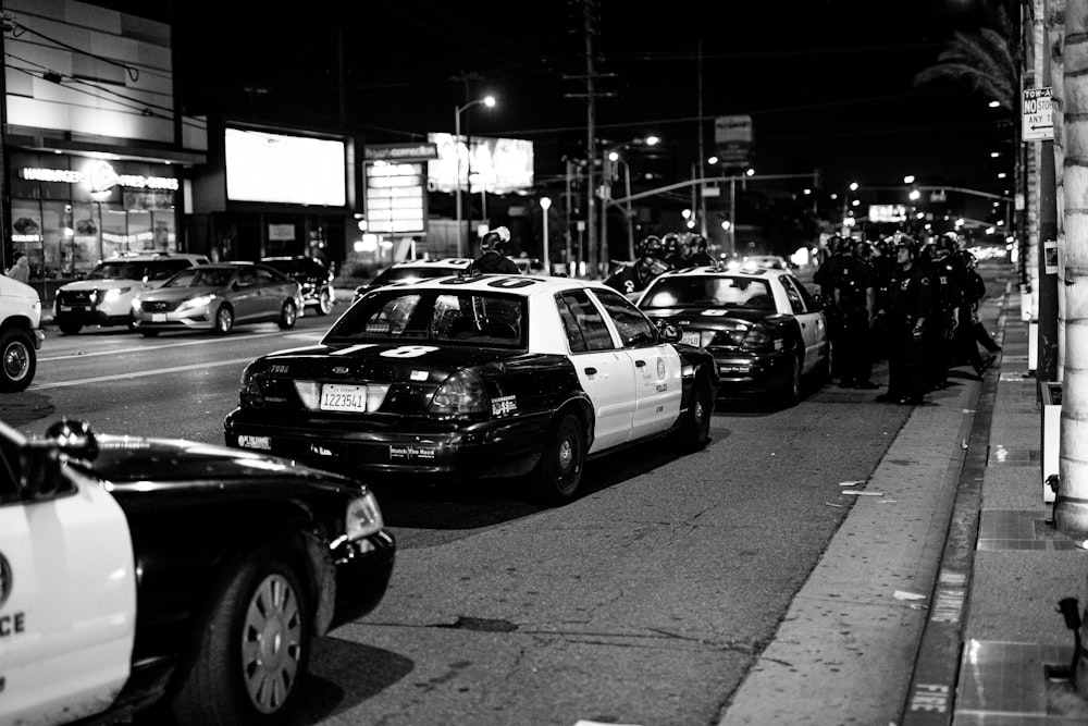 grayscale photo of cars on road