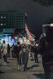 people walking on street during nighttime