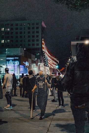 people walking on street during nighttime