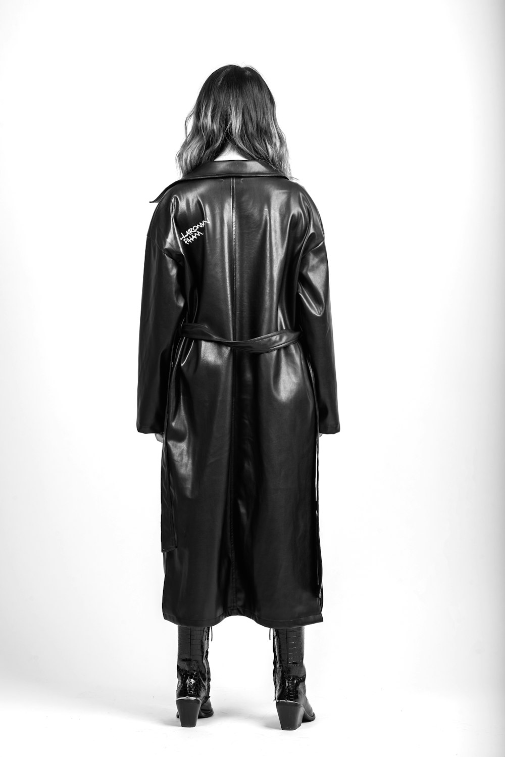 woman in black coat standing
