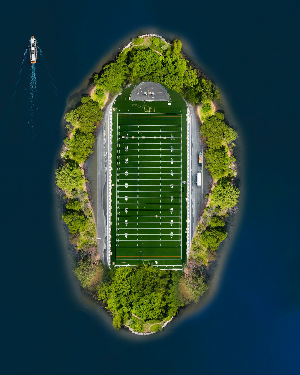 aerial view of green stadium on top of hill during daytime