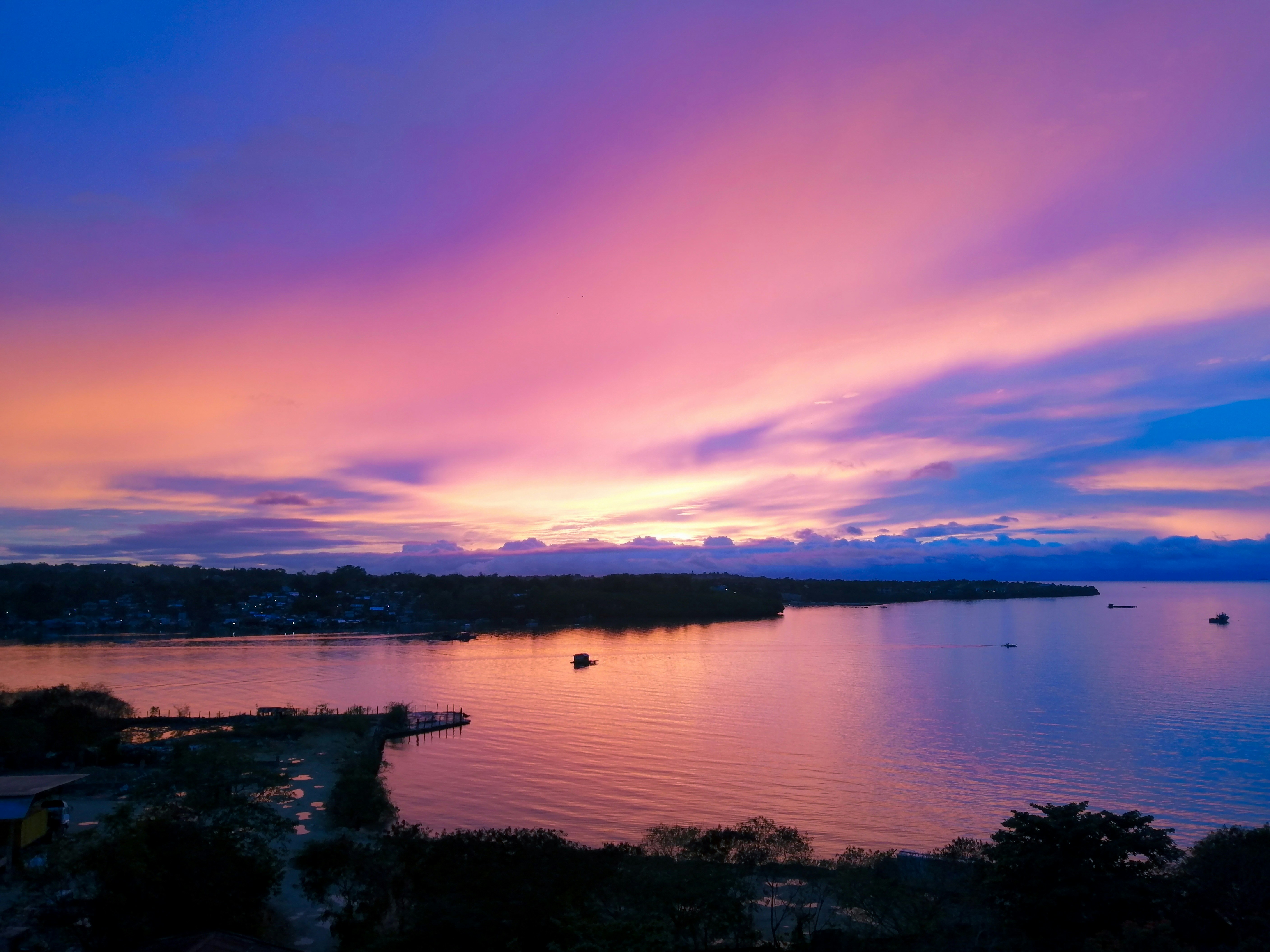 body of water during sunset
