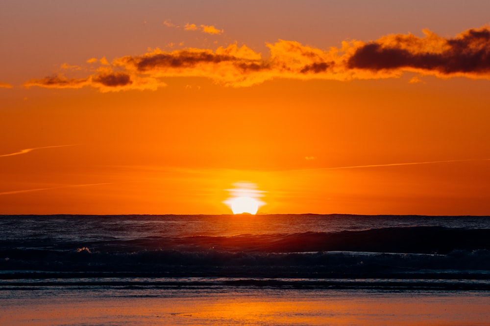 body of water during sunset