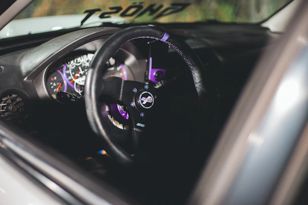 A sleek dark-themed dashboard showcasing deep purple and lime green accents.