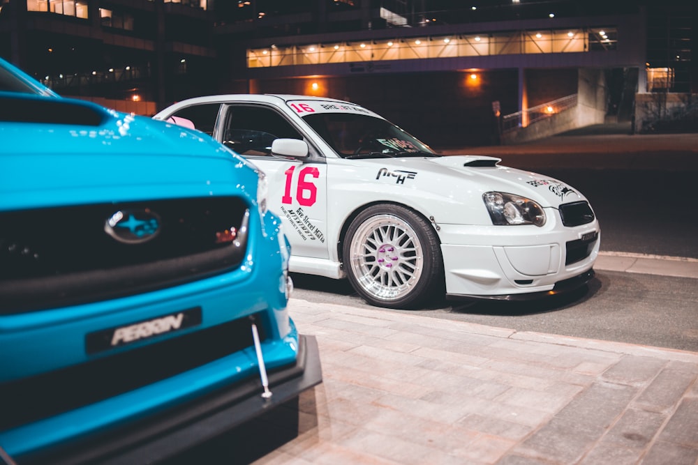 white and blue bmw m 3 coupe