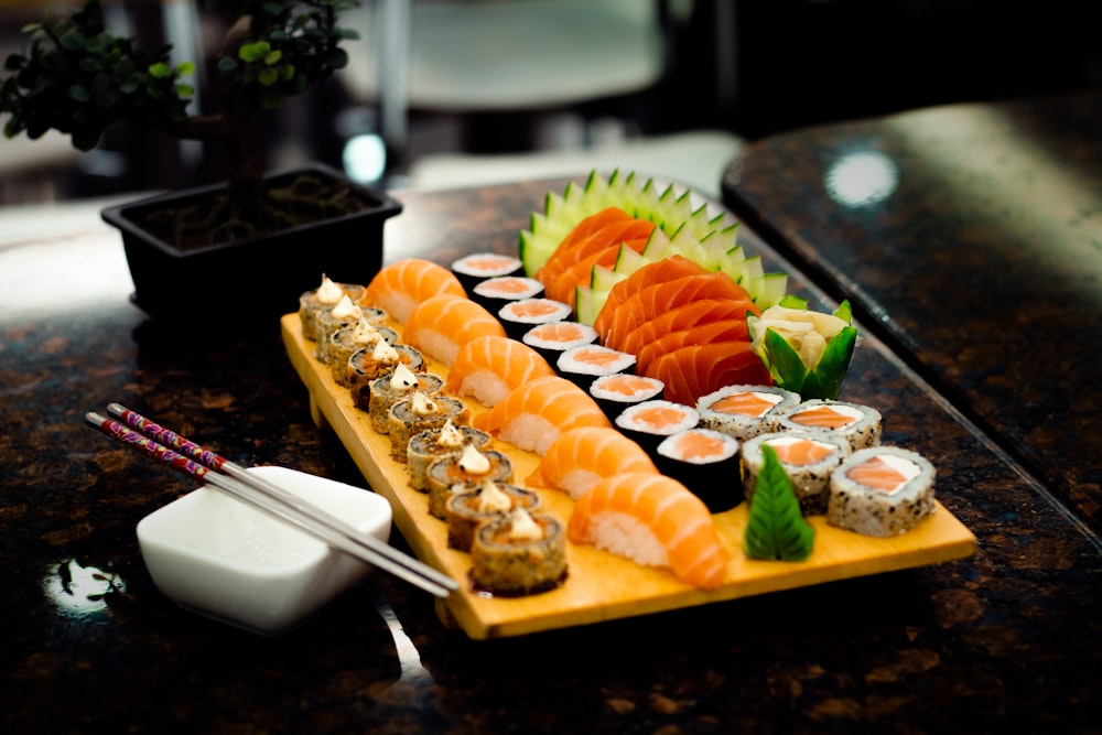 sliced bread with sliced fruits on brown wooden tray