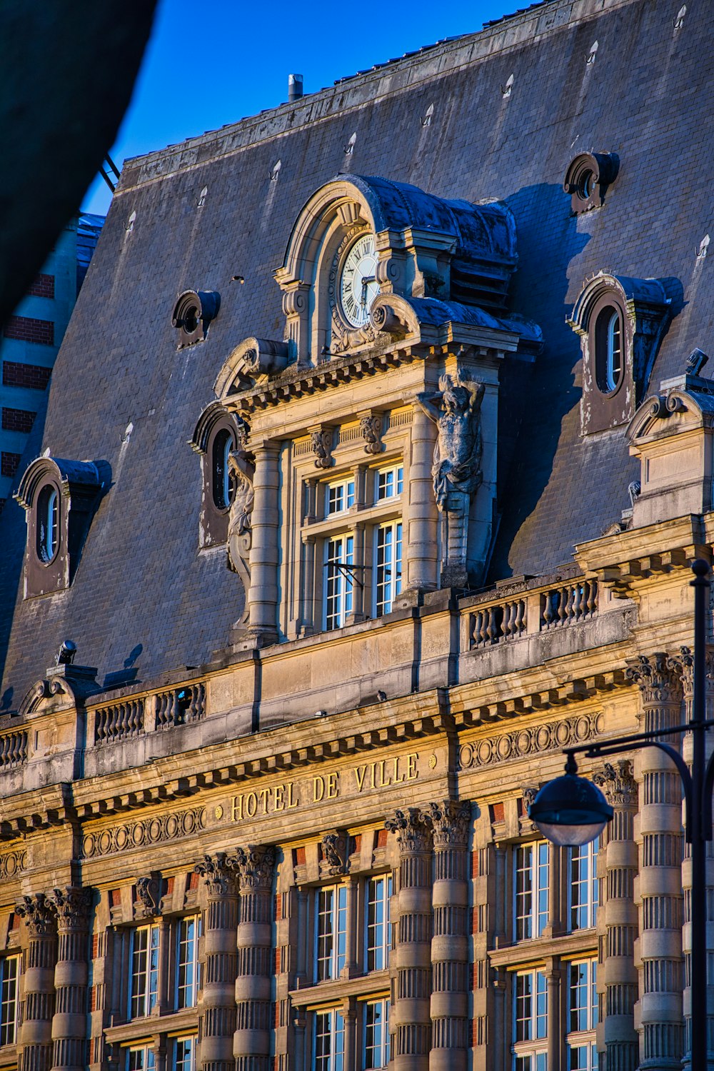 beige concrete building with clock