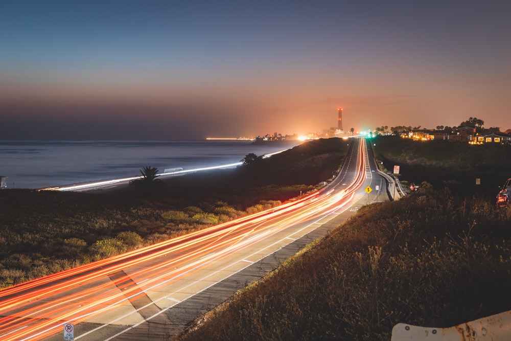 time lapse photography of cars on road during night time