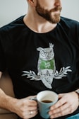 man in black and green crew neck t-shirt