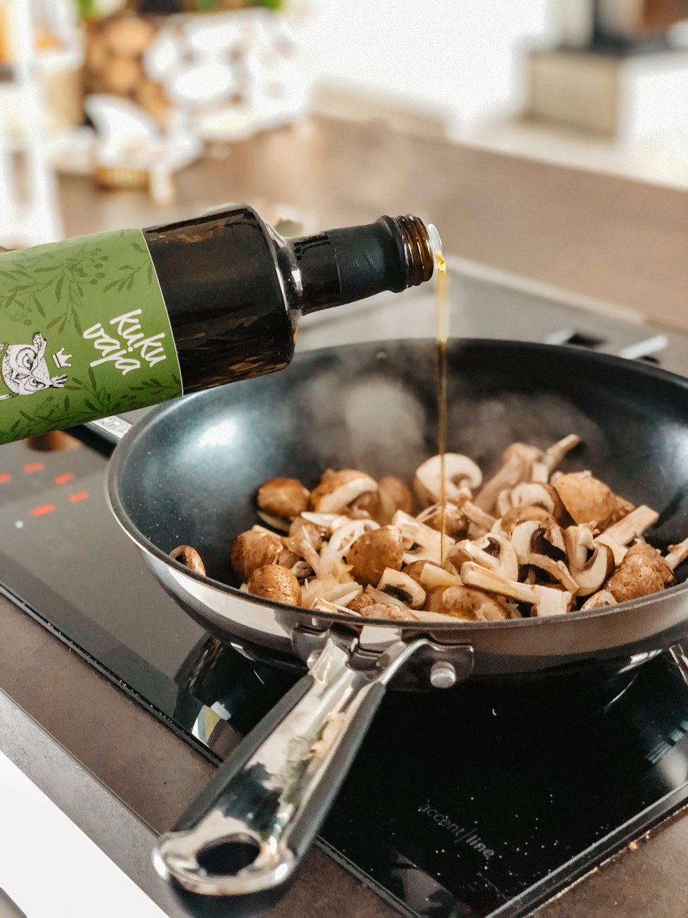 brown and black mushroom on black frying pan