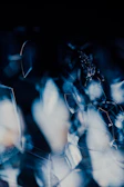 Geometric shapes layered with transparent glassmorphism effects.