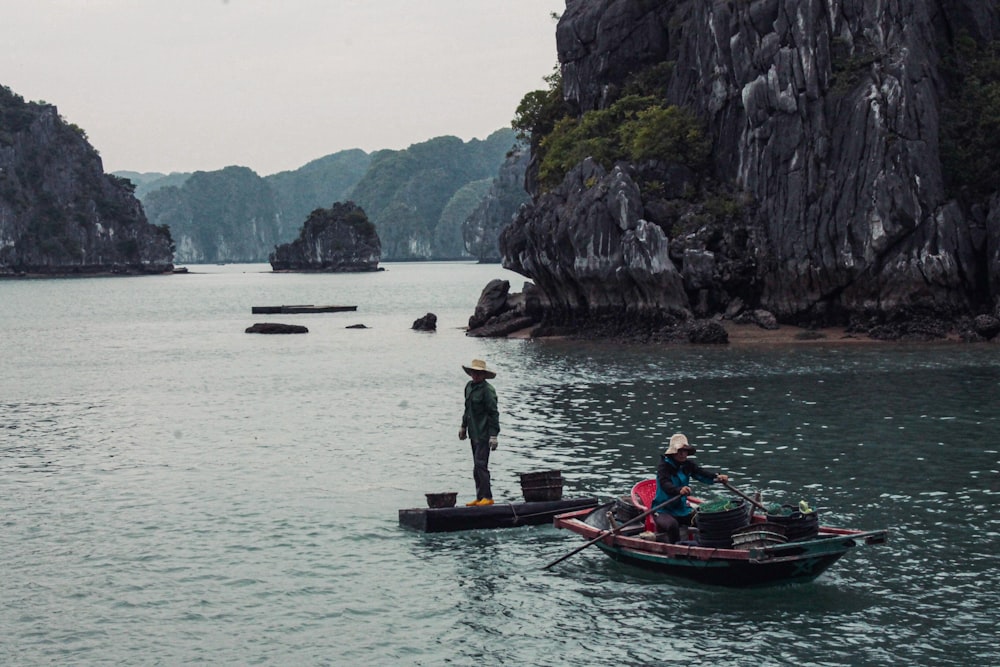 people riding on boat on body of water during daytime