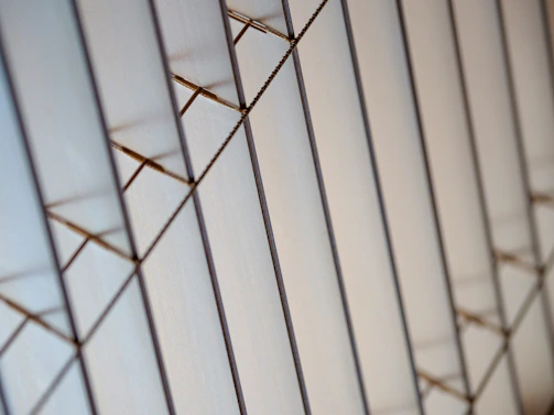 Close-up of sharp, intersecting lines forming a precise, minimalistic pattern.