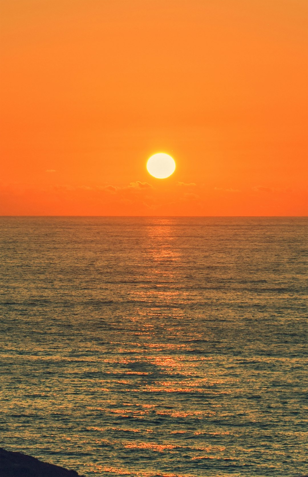 body of water during sunset