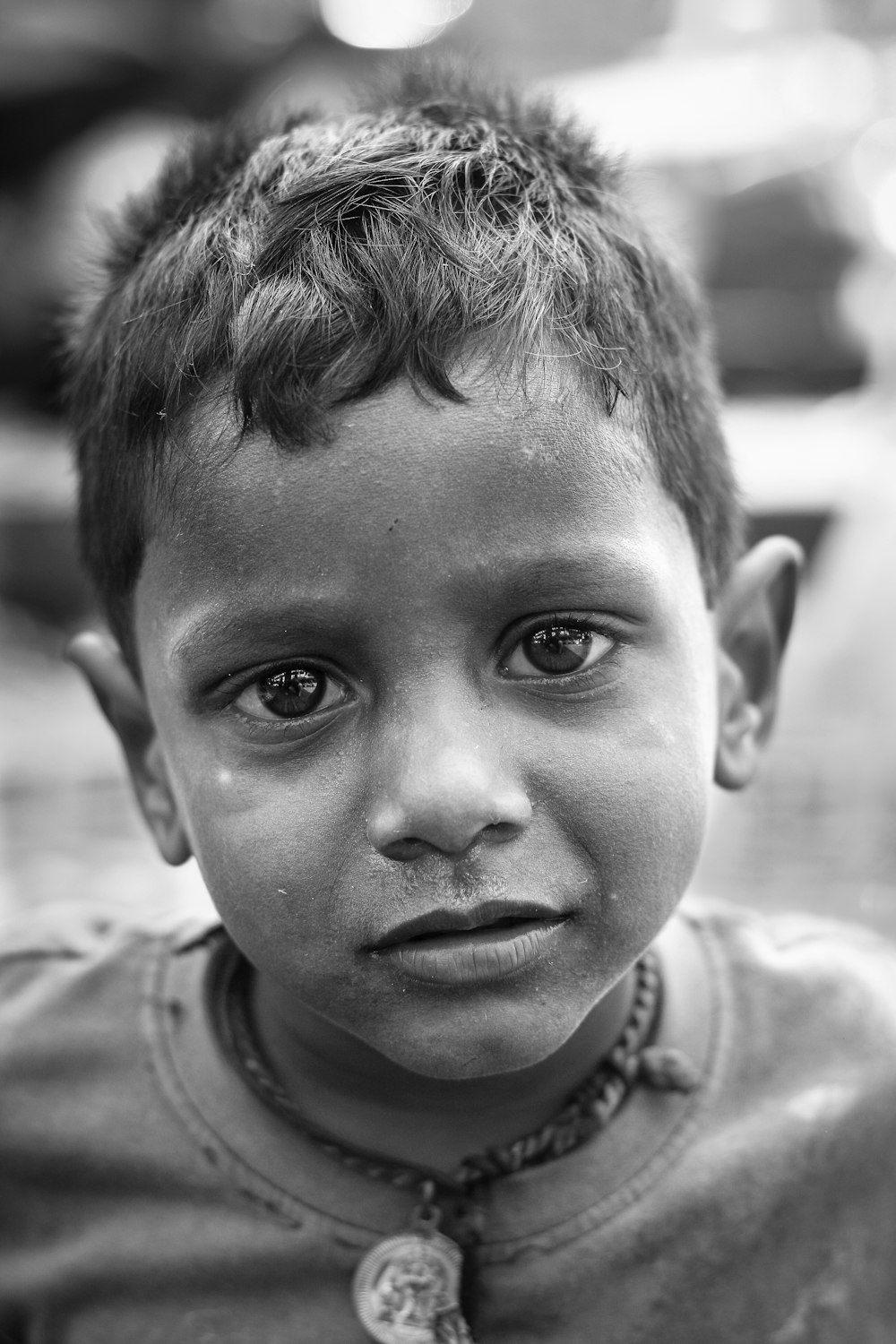 grayscale photo of boy in crew neck shirt