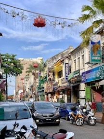 cars parked on street near buildings during daytime
