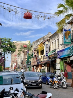 cars parked on street near buildings during daytime