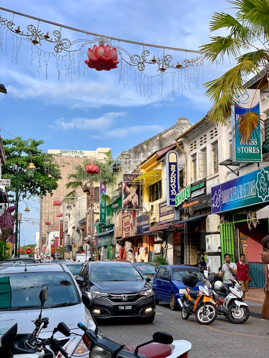 cars parked on street near buildings during daytime in Penang Island Malaysia