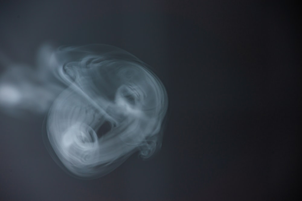 white smoke in black background