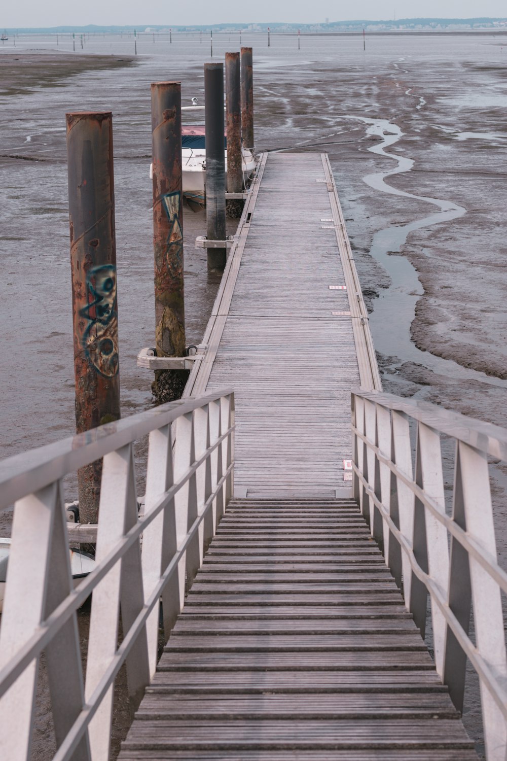 brown wooden dock on sea during daytime