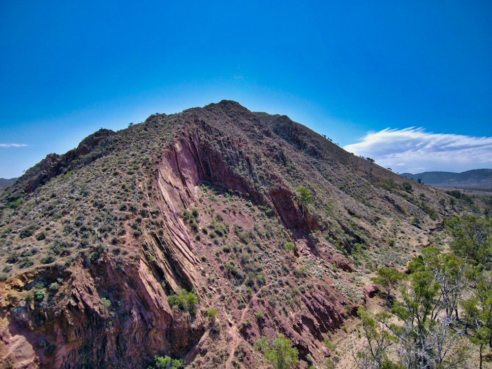 brown rocky mountain under blue sky during daytime