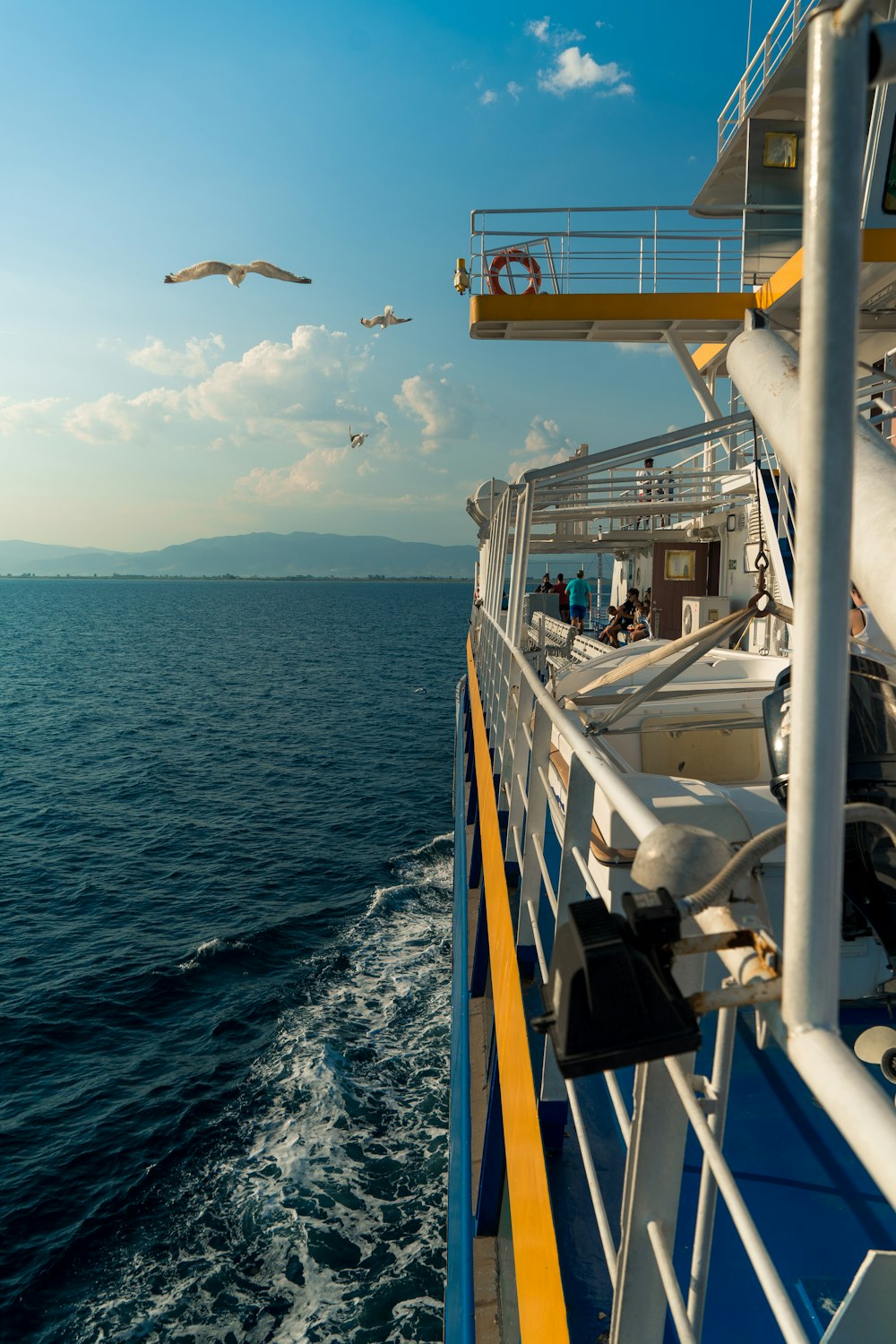 white and blue boat on sea during daytime