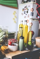 A cozy kitchen scene showing homemade condiments being prepared with fresh ingredients.