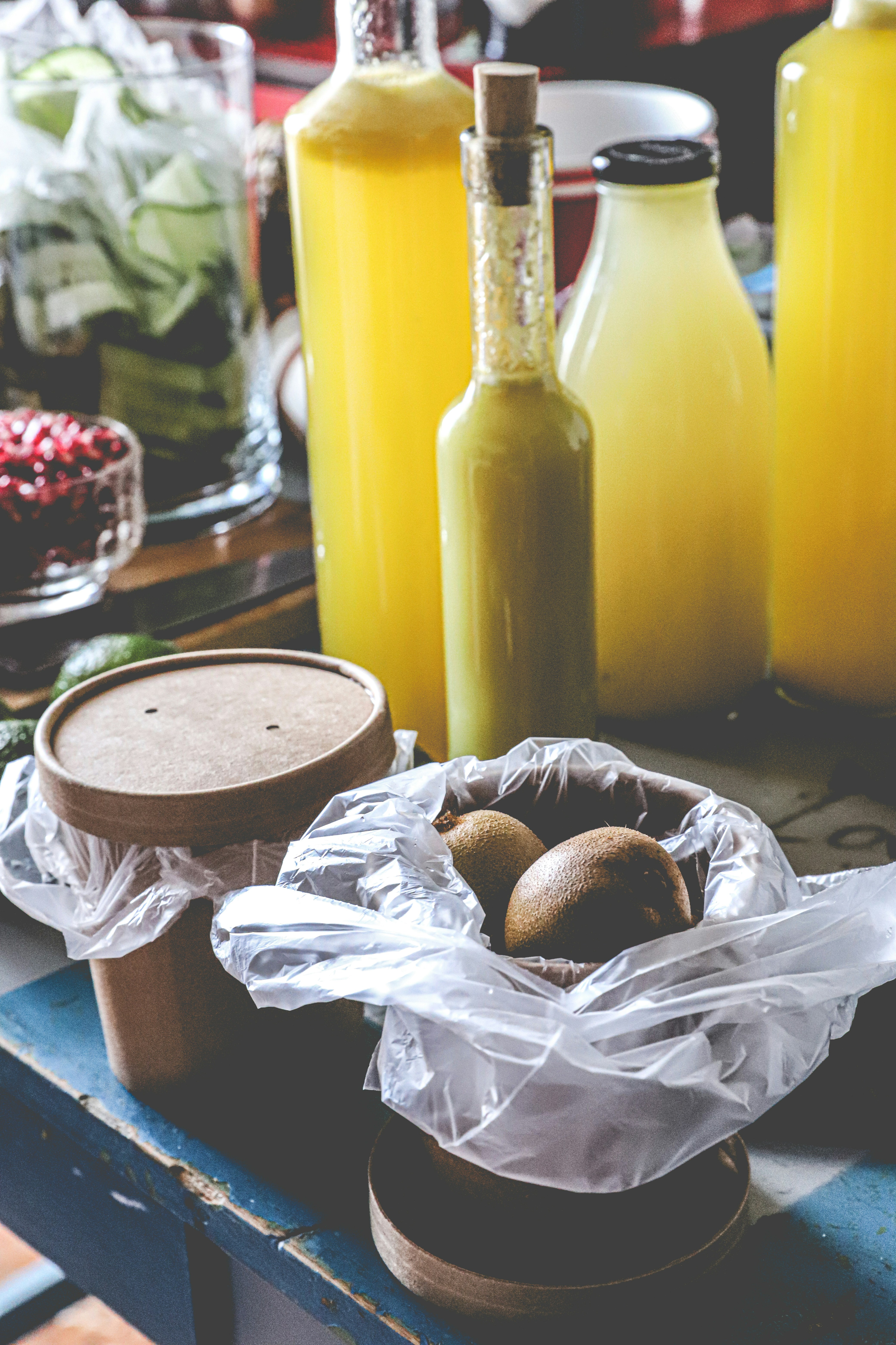 brown bread on white plastic bag beside yellow plastic bottle