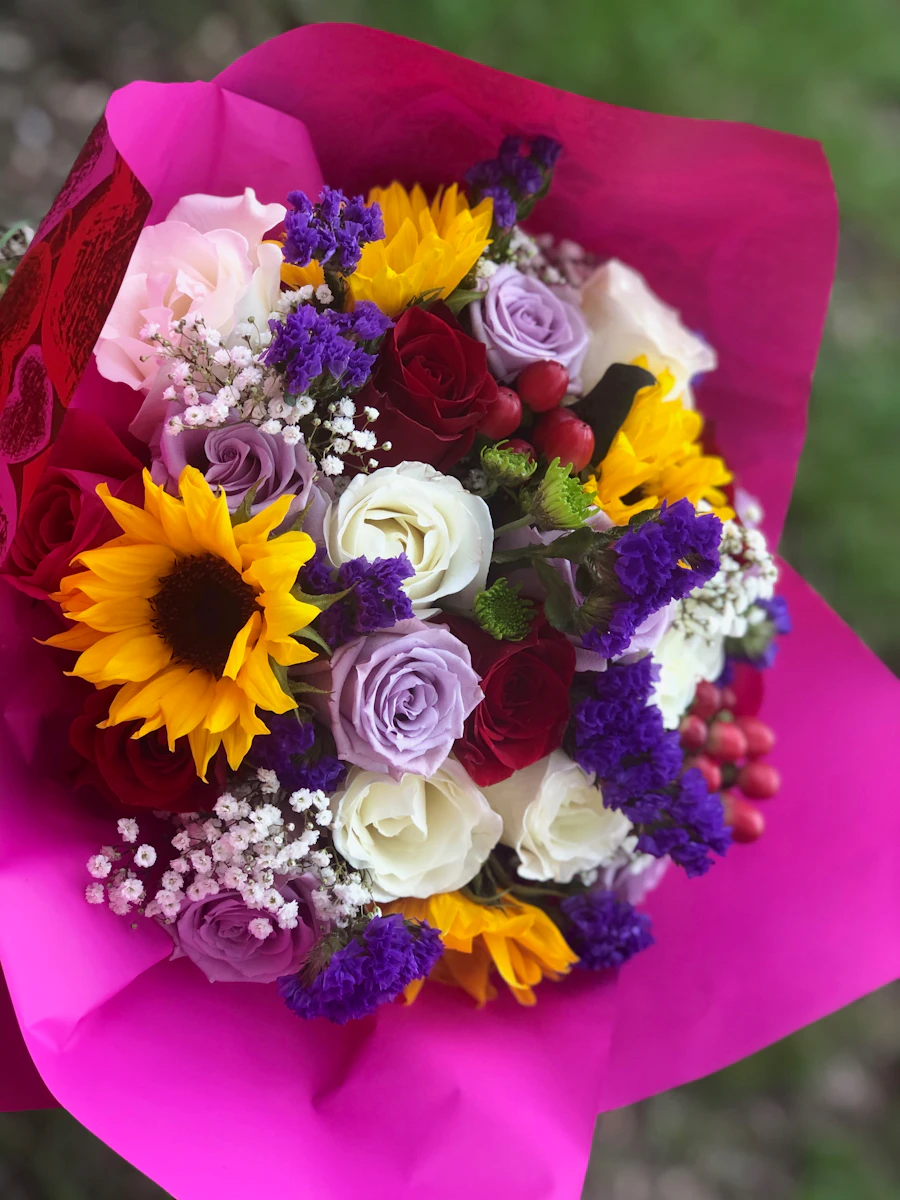 Bold colorful graduation bouquet with mixed seasonal blooms