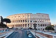 cars parked on road near brown concrete building during daytime