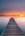 brown wooden dock on sea during sunset